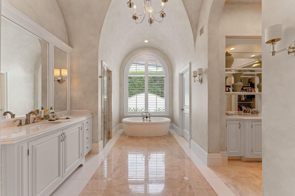 Welcome to 107 W Bears Club Dr, an exquisite custom-built estate in the exclusive Bears Club community in Jupiter, Florida.