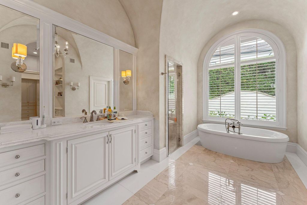 Welcome to 107 W Bears Club Dr, an exquisite custom-built estate in the exclusive Bears Club community in Jupiter, Florida.