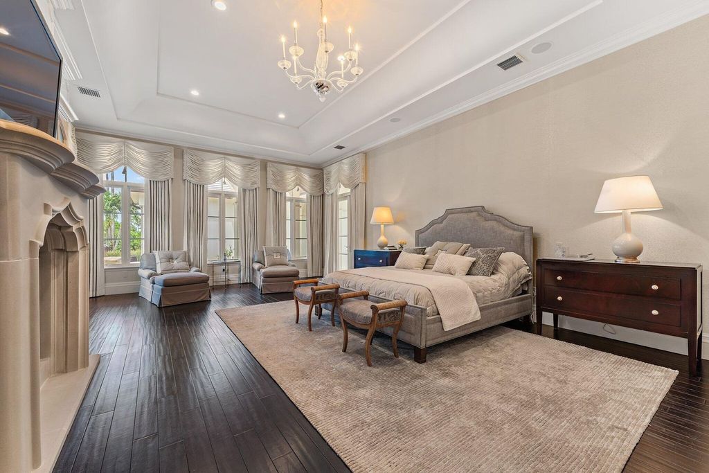 Welcome to 107 W Bears Club Dr, an exquisite custom-built estate in the exclusive Bears Club community in Jupiter, Florida.