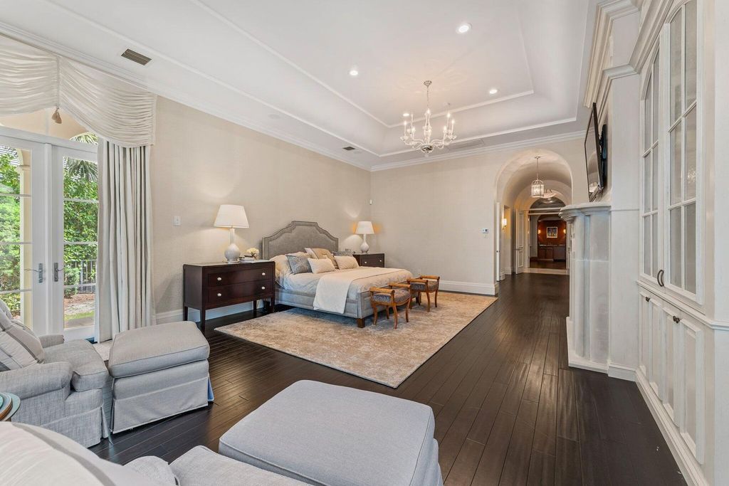 Welcome to 107 W Bears Club Dr, an exquisite custom-built estate in the exclusive Bears Club community in Jupiter, Florida.