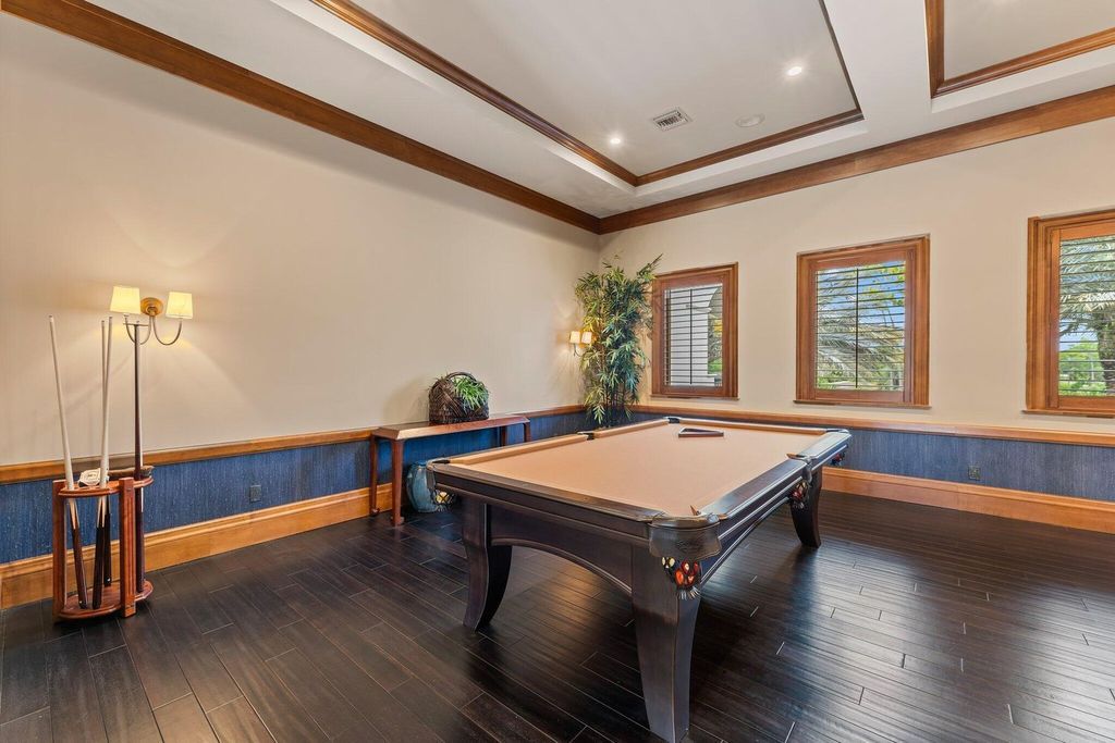 Welcome to 107 W Bears Club Dr, an exquisite custom-built estate in the exclusive Bears Club community in Jupiter, Florida.