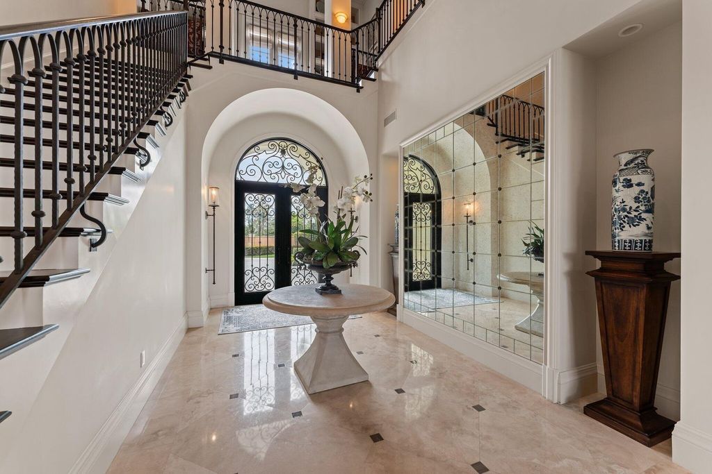 Welcome to 107 W Bears Club Dr, an exquisite custom-built estate in the exclusive Bears Club community in Jupiter, Florida.