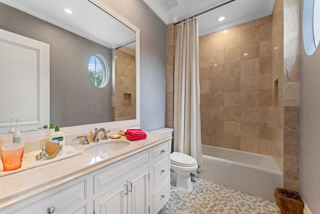 Welcome to 107 W Bears Club Dr, an exquisite custom-built estate in the exclusive Bears Club community in Jupiter, Florida.