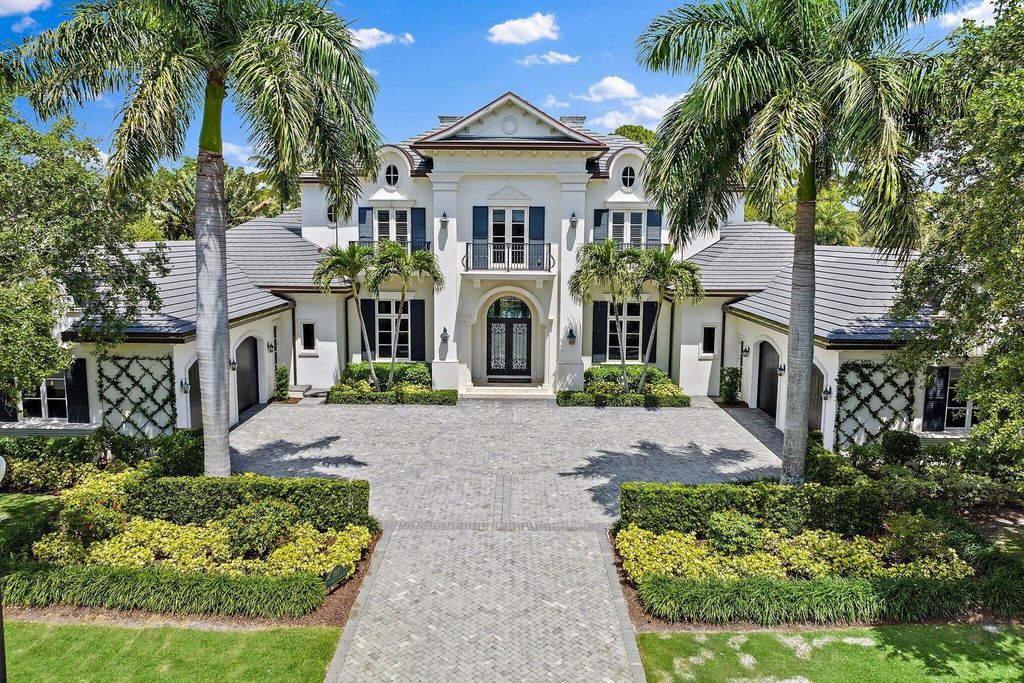 Welcome to 107 W Bears Club Dr, an exquisite custom-built estate in the exclusive Bears Club community in Jupiter, Florida.