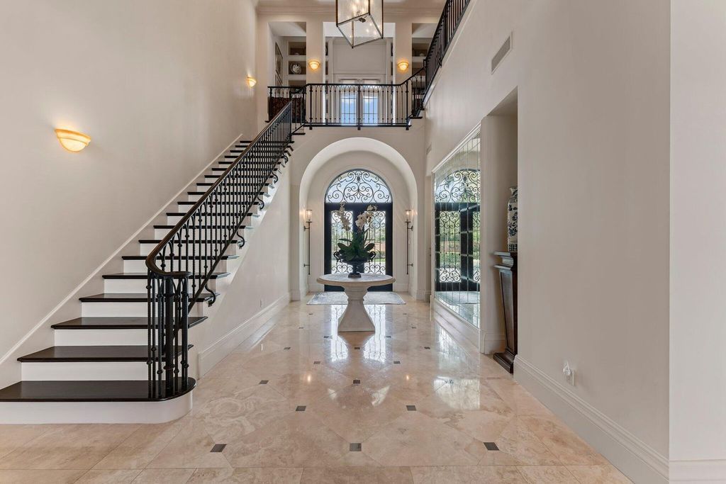Welcome to 107 W Bears Club Dr, an exquisite custom-built estate in the exclusive Bears Club community in Jupiter, Florida.