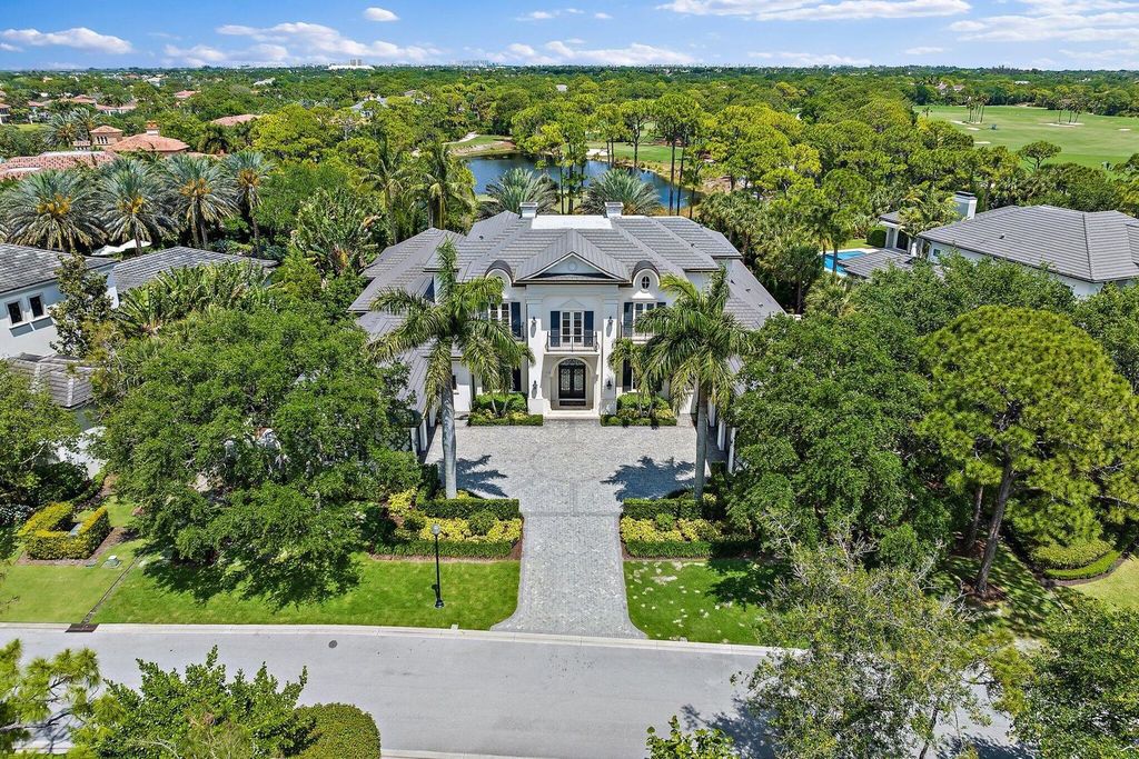 Welcome to 107 W Bears Club Dr, an exquisite custom-built estate in the exclusive Bears Club community in Jupiter, Florida.