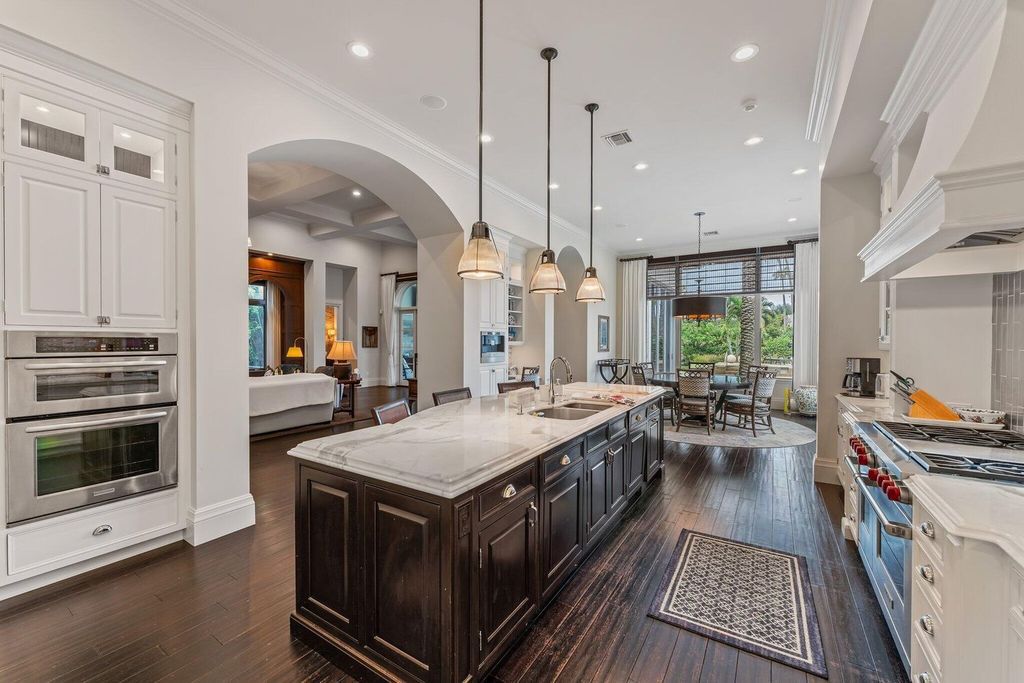 Welcome to 107 W Bears Club Dr, an exquisite custom-built estate in the exclusive Bears Club community in Jupiter, Florida.