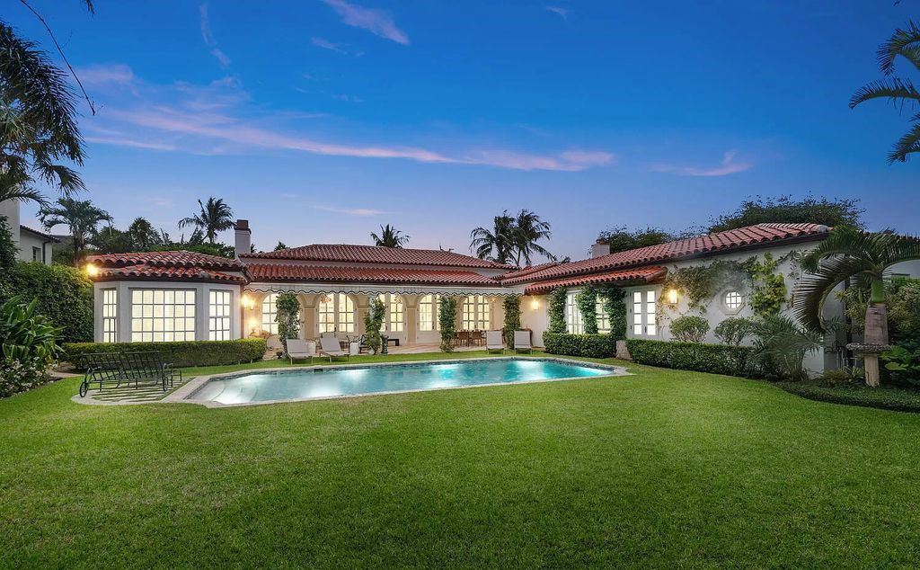 Designed by renowned architect John Volk, this magnificent residence, "The Ballroom," features 6 bedrooms, 6 bathrooms, and 5,612 square feet of living space on a 0.43-acre lot.
