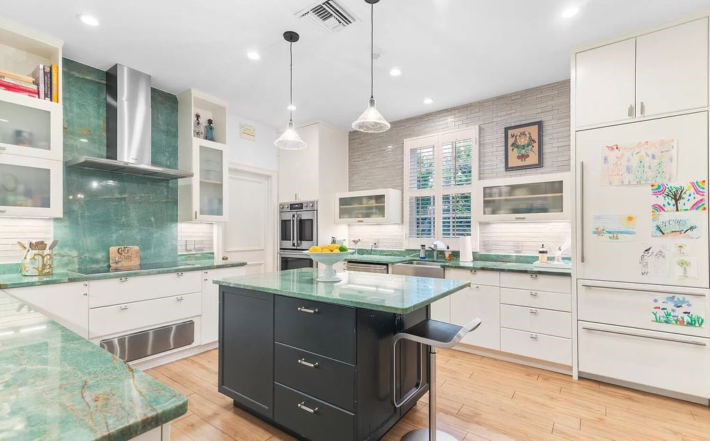 Designed by renowned architect John Volk, this magnificent residence, "The Ballroom," features 6 bedrooms, 6 bathrooms, and 5,612 square feet of living space on a 0.43-acre lot.
