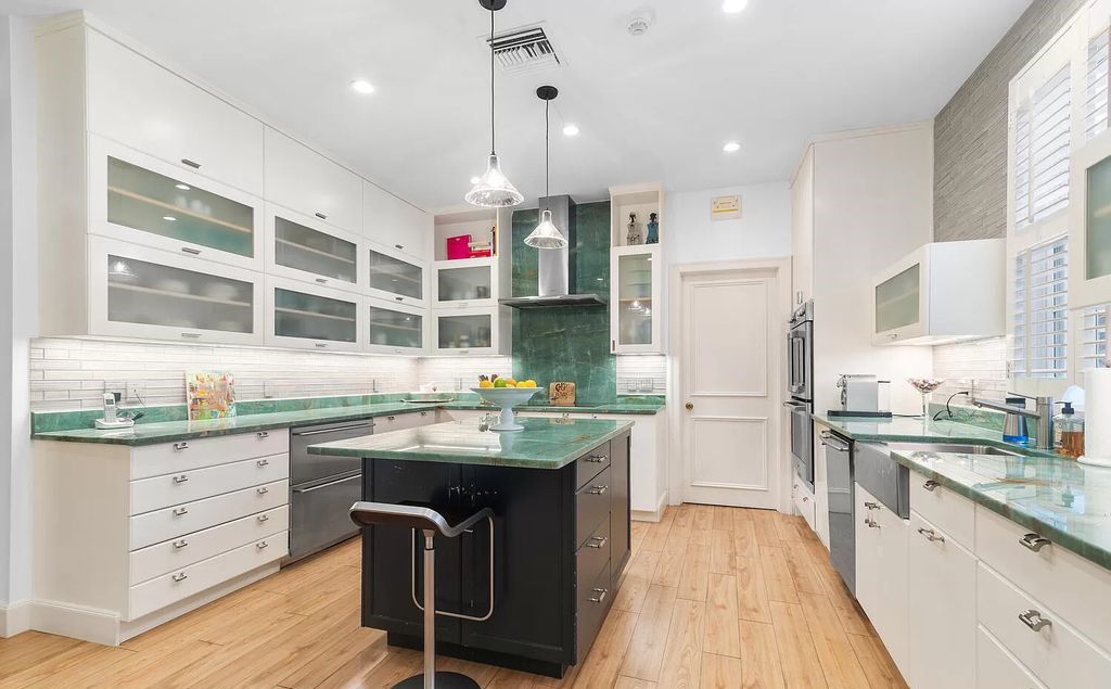 Designed by renowned architect John Volk, this magnificent residence, "The Ballroom," features 6 bedrooms, 6 bathrooms, and 5,612 square feet of living space on a 0.43-acre lot.