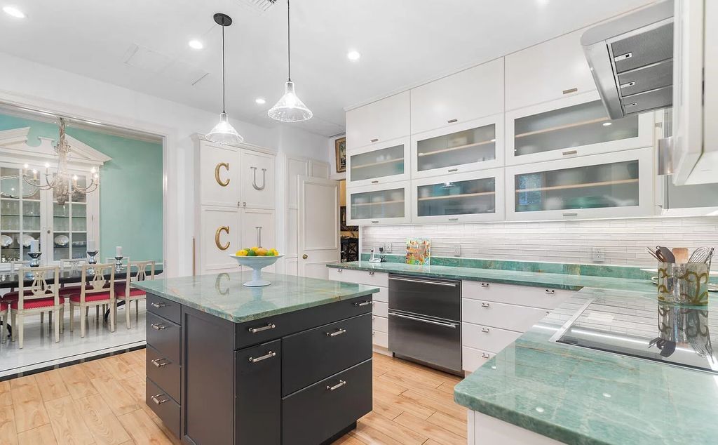 Designed by renowned architect John Volk, this magnificent residence, "The Ballroom," features 6 bedrooms, 6 bathrooms, and 5,612 square feet of living space on a 0.43-acre lot.