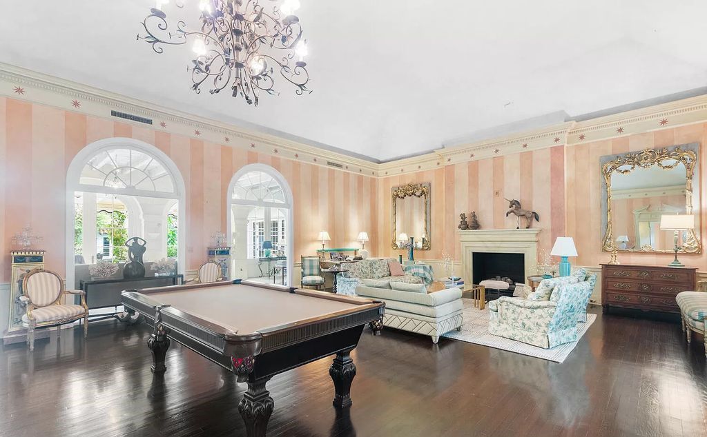Designed by renowned architect John Volk, this magnificent residence, "The Ballroom," features 6 bedrooms, 6 bathrooms, and 5,612 square feet of living space on a 0.43-acre lot.
