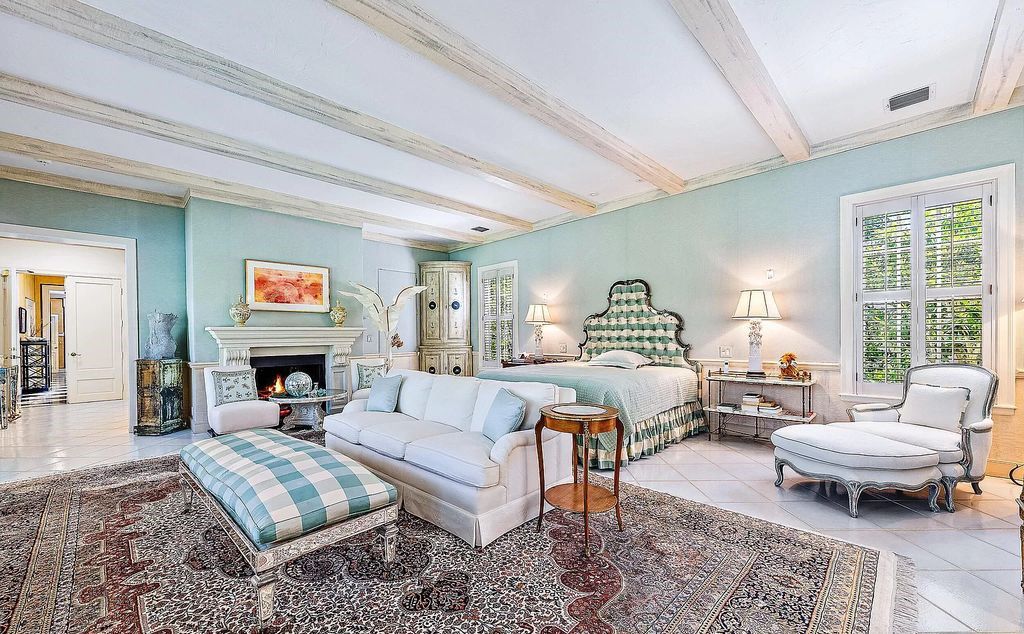 Designed by renowned architect John Volk, this magnificent residence, "The Ballroom," features 6 bedrooms, 6 bathrooms, and 5,612 square feet of living space on a 0.43-acre lot.