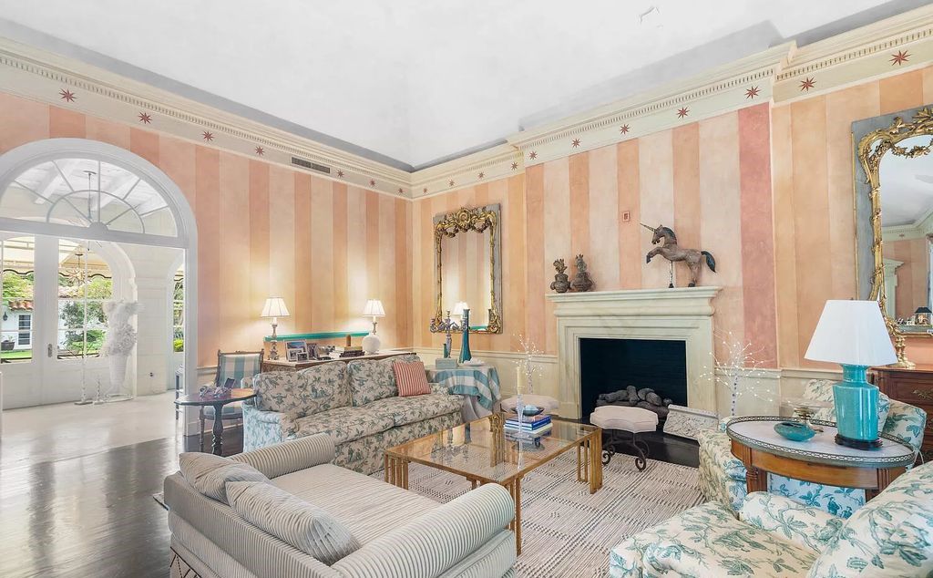 Designed by renowned architect John Volk, this magnificent residence, "The Ballroom," features 6 bedrooms, 6 bathrooms, and 5,612 square feet of living space on a 0.43-acre lot.