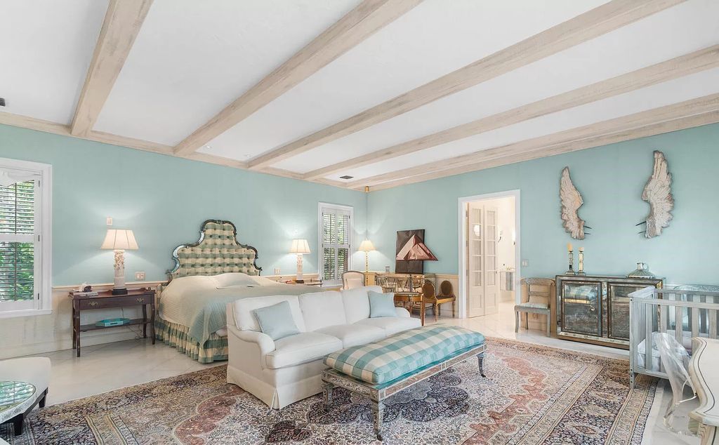 Designed by renowned architect John Volk, this magnificent residence, "The Ballroom," features 6 bedrooms, 6 bathrooms, and 5,612 square feet of living space on a 0.43-acre lot.