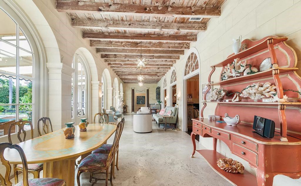 Designed by renowned architect John Volk, this magnificent residence, "The Ballroom," features 6 bedrooms, 6 bathrooms, and 5,612 square feet of living space on a 0.43-acre lot.