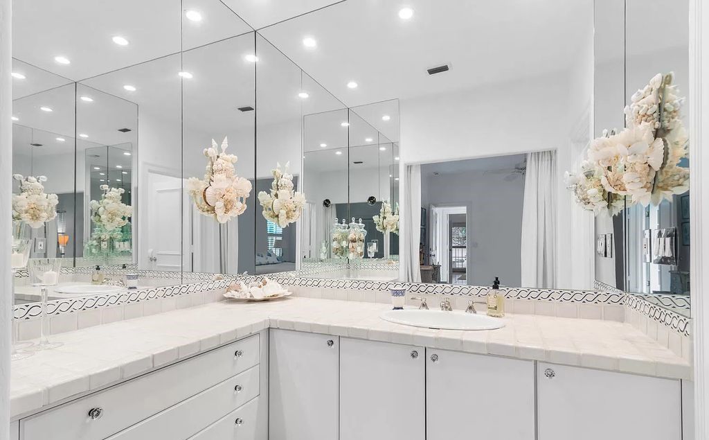Designed by renowned architect John Volk, this magnificent residence, "The Ballroom," features 6 bedrooms, 6 bathrooms, and 5,612 square feet of living space on a 0.43-acre lot.