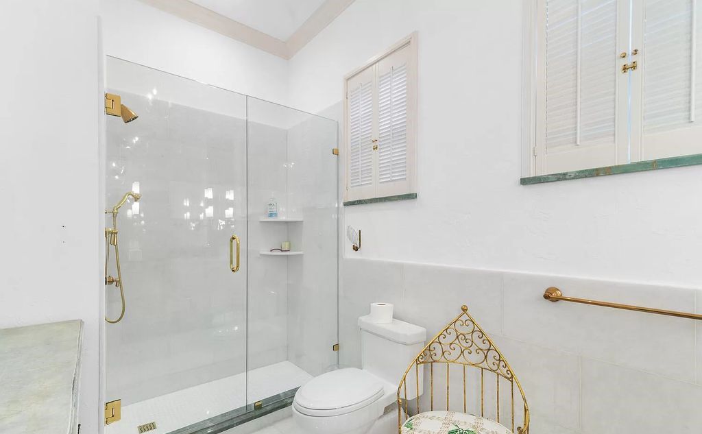 Designed by renowned architect John Volk, this magnificent residence, "The Ballroom," features 6 bedrooms, 6 bathrooms, and 5,612 square feet of living space on a 0.43-acre lot.