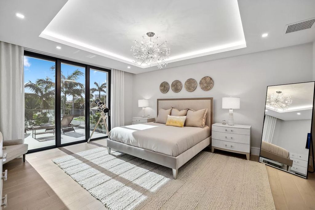This 5-bed, 7-bath masterpiece, built in 2021, spans over 6,159 sq ft on a 0.30-acre lot. Highlights include a 2-story great room with stunning glass walls and a gas fireplace, a formal dining room with a glass wine closet, a custom kitchen with double-thick quartzite countertops, Miele appliances, and Carrara porcelain tiles.