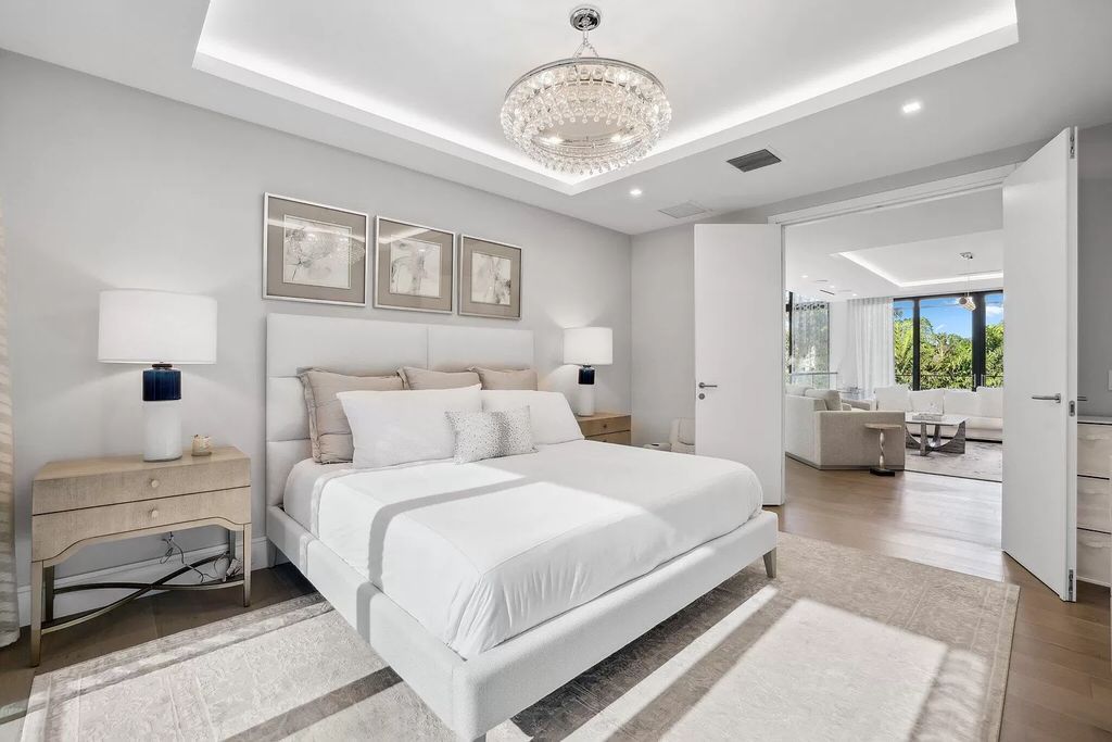 This 5-bed, 7-bath masterpiece, built in 2021, spans over 6,159 sq ft on a 0.30-acre lot. Highlights include a 2-story great room with stunning glass walls and a gas fireplace, a formal dining room with a glass wine closet, a custom kitchen with double-thick quartzite countertops, Miele appliances, and Carrara porcelain tiles.
