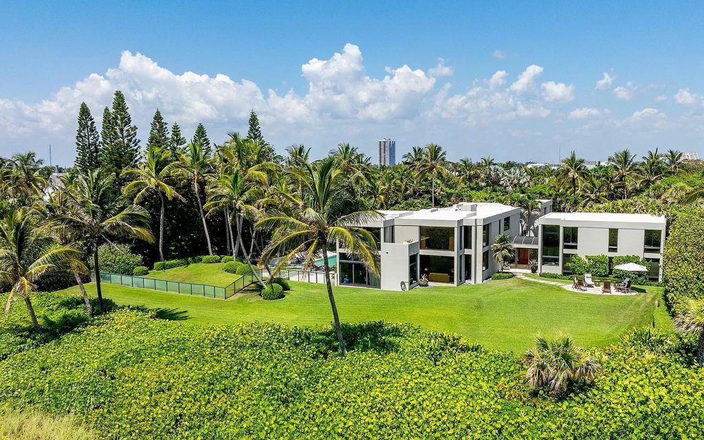 Welcome to an exquisite oceanfront estate located in the prestigious Palm Beach, Florida. This stunning property at 1446 N Ocean Blvd offers an unparalleled coastal living experience with 7 bedrooms and 5 bathrooms, spread across a luxurious 8,005 square feet of living space.