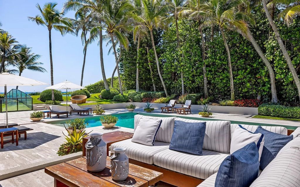 Welcome to an exquisite oceanfront estate located in the prestigious Palm Beach, Florida. This stunning property at 1446 N Ocean Blvd offers an unparalleled coastal living experience with 7 bedrooms and 5 bathrooms, spread across a luxurious 8,005 square feet of living space.