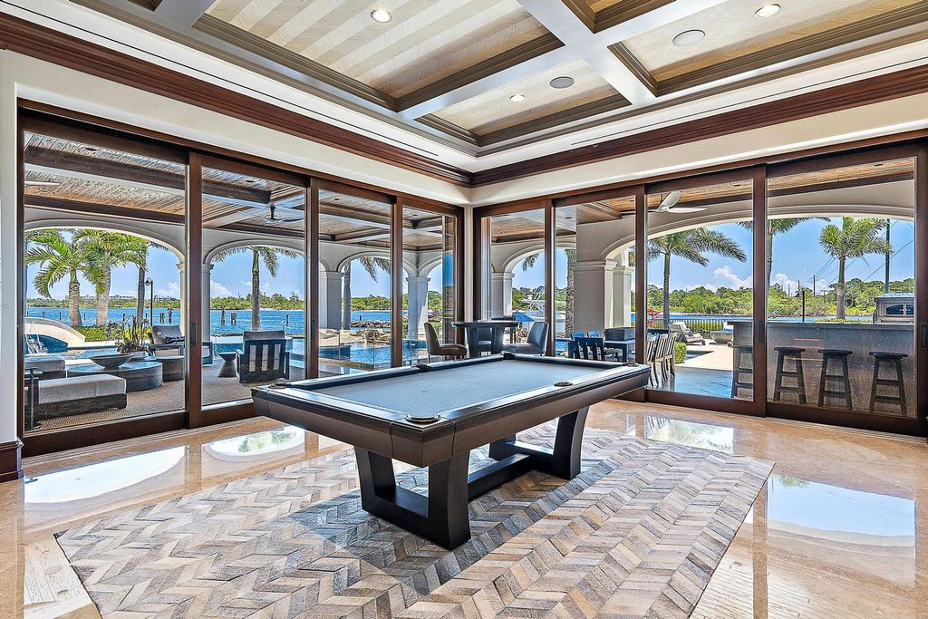 Nestled within the prestigious Admirals Cove community, this Ultimate Trophy Property, originally completed in 2016 and newly remodeled in 2023, offers unparalleled luxury and coastal living.