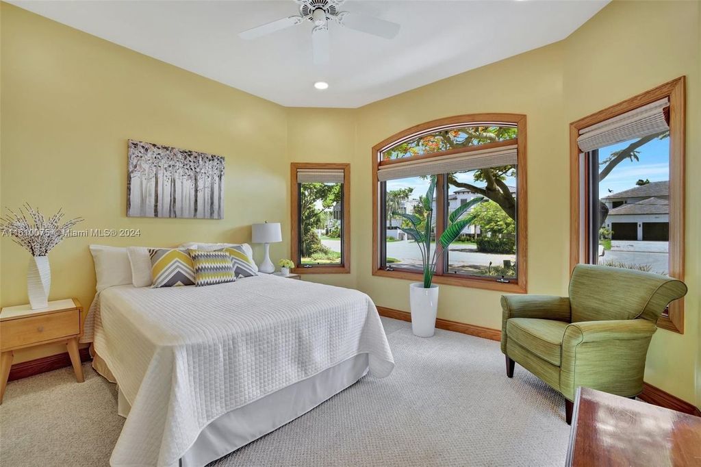 A boater's dream, the estate sits on a 12,651 square feet lot with a 2,000 square feet dock and boat lift. The 6,788 square feet home features generous living areas, an elevator, and an expansive second-floor terrace with an oversized primary bedroom, loft, and office den.