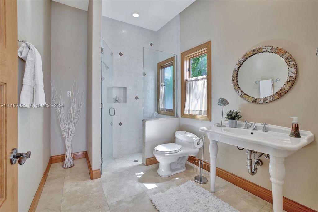 A boater's dream, the estate sits on a 12,651 square feet lot with a 2,000 square feet dock and boat lift. The 6,788 square feet home features generous living areas, an elevator, and an expansive second-floor terrace with an oversized primary bedroom, loft, and office den.