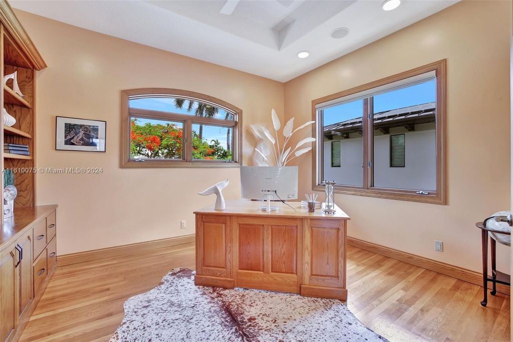 A boater's dream, the estate sits on a 12,651 square feet lot with a 2,000 square feet dock and boat lift. The 6,788 square feet home features generous living areas, an elevator, and an expansive second-floor terrace with an oversized primary bedroom, loft, and office den.