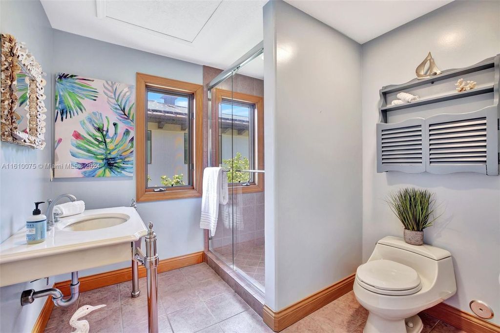 A boater's dream, the estate sits on a 12,651 square feet lot with a 2,000 square feet dock and boat lift. The 6,788 square feet home features generous living areas, an elevator, and an expansive second-floor terrace with an oversized primary bedroom, loft, and office den.