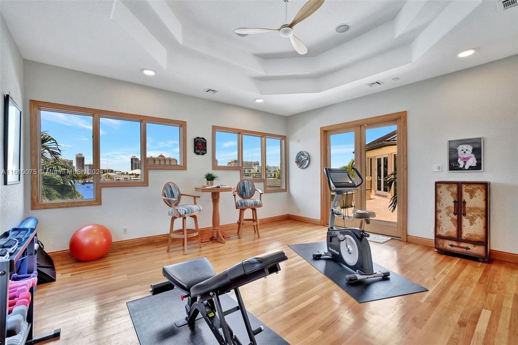 A boater's dream, the estate sits on a 12,651 square feet lot with a 2,000 square feet dock and boat lift. The 6,788 square feet home features generous living areas, an elevator, and an expansive second-floor terrace with an oversized primary bedroom, loft, and office den.