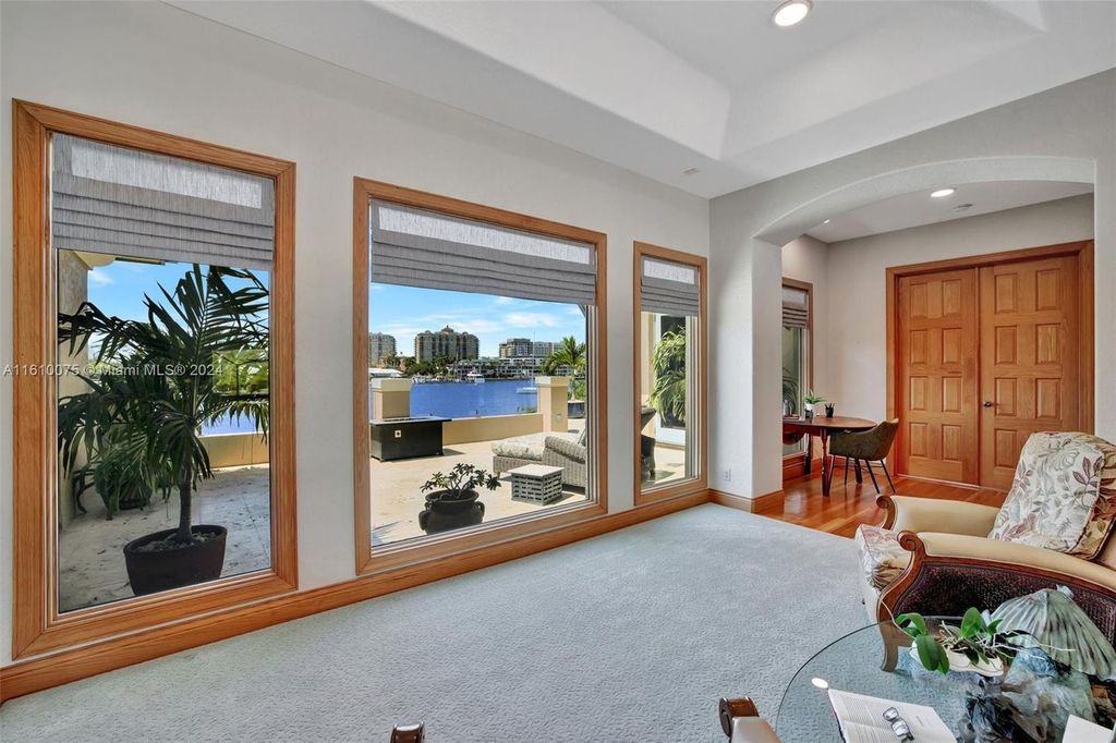 A boater's dream, the estate sits on a 12,651 square feet lot with a 2,000 square feet dock and boat lift. The 6,788 square feet home features generous living areas, an elevator, and an expansive second-floor terrace with an oversized primary bedroom, loft, and office den.