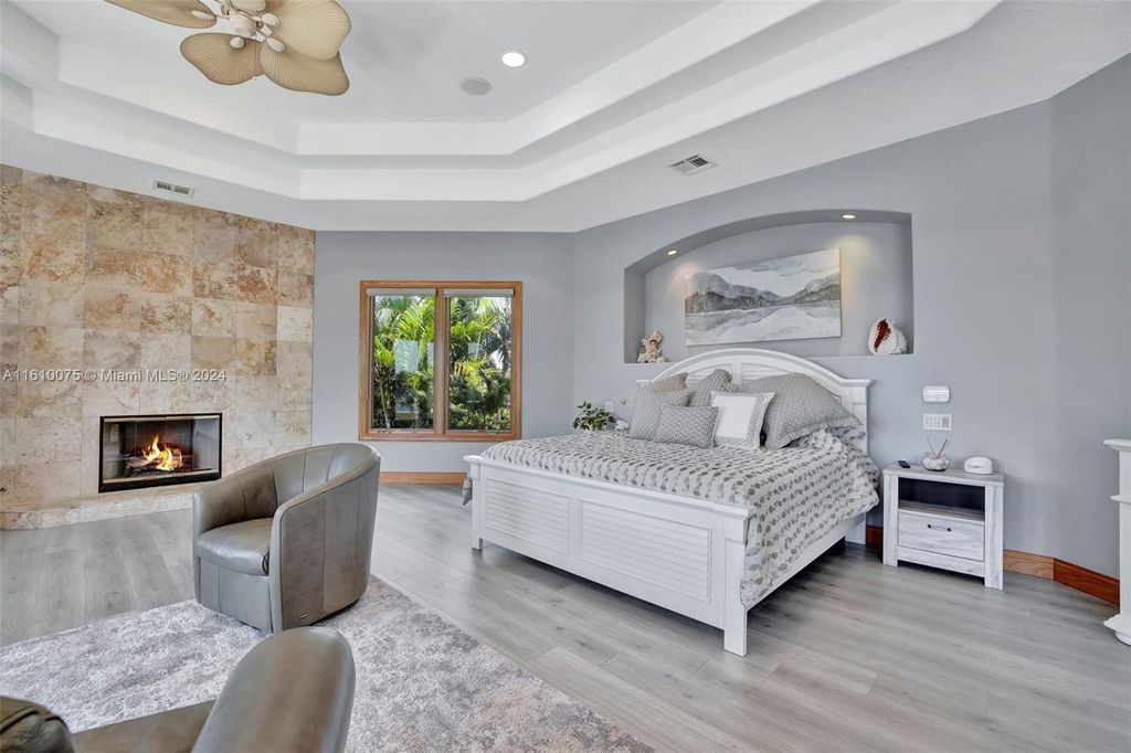A boater's dream, the estate sits on a 12,651 square feet lot with a 2,000 square feet dock and boat lift. The 6,788 square feet home features generous living areas, an elevator, and an expansive second-floor terrace with an oversized primary bedroom, loft, and office den.
