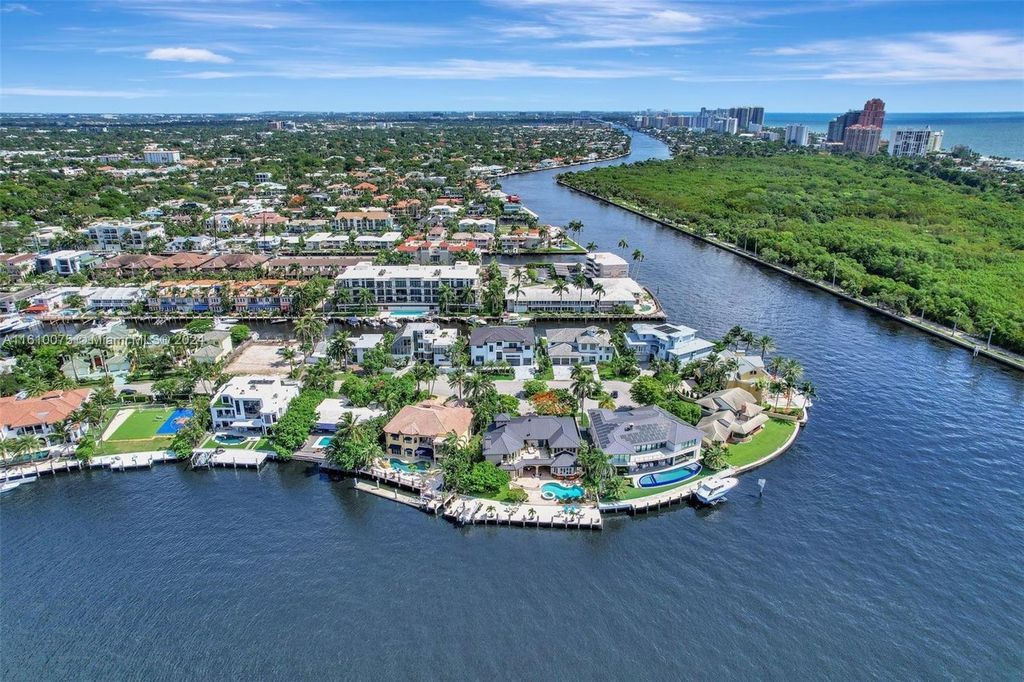 A boater's dream, the estate sits on a 12,651 square feet lot with a 2,000 square feet dock and boat lift. The 6,788 square feet home features generous living areas, an elevator, and an expansive second-floor terrace with an oversized primary bedroom, loft, and office den.