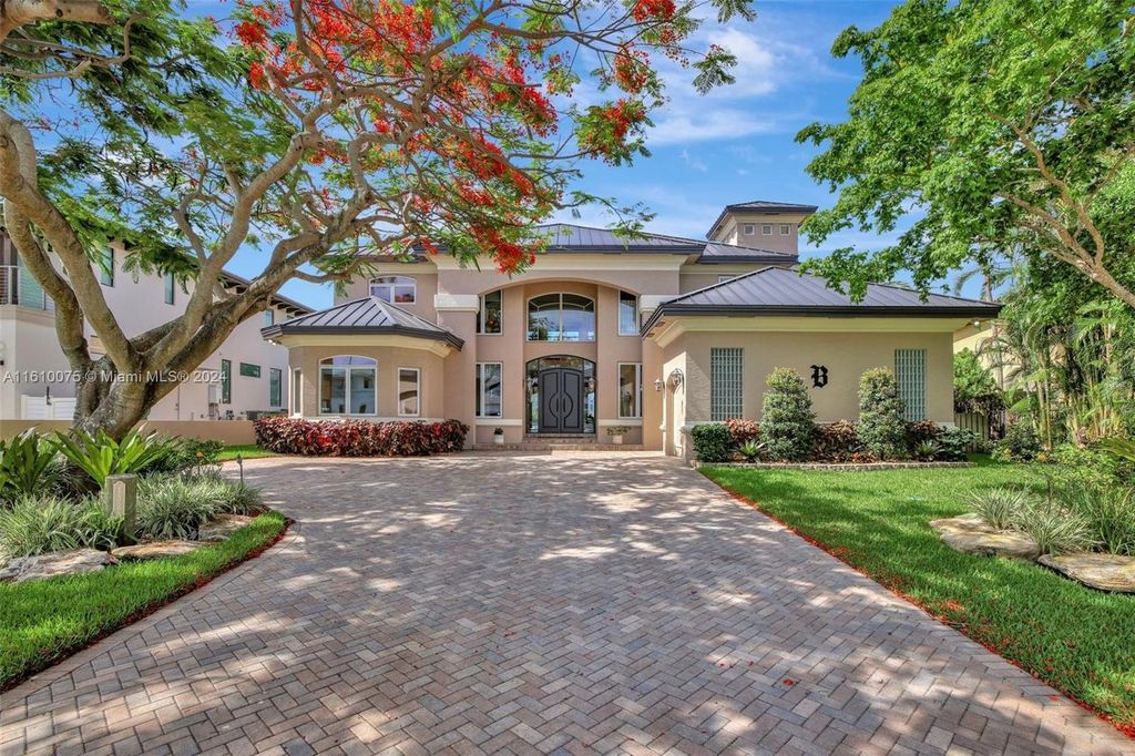 A boater's dream, the estate sits on a 12,651 square feet lot with a 2,000 square feet dock and boat lift. The 6,788 square feet home features generous living areas, an elevator, and an expansive second-floor terrace with an oversized primary bedroom, loft, and office den.