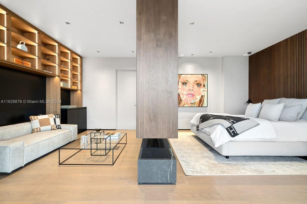 Discover an extraordinary waterfront compound in gated San Souci Estates, featuring a brand new ultra-modern home and a sophisticated guest house on a double lot.