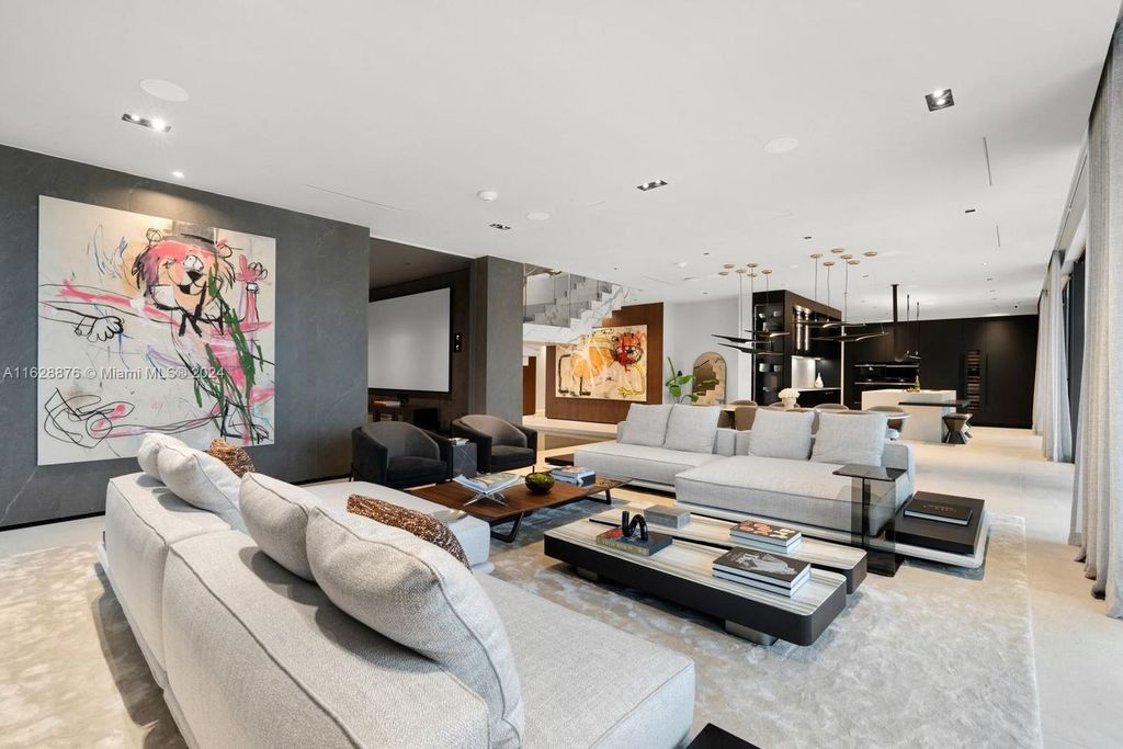 Discover an extraordinary waterfront compound in gated San Souci Estates, featuring a brand new ultra-modern home and a sophisticated guest house on a double lot.