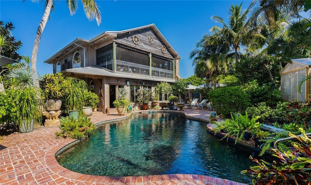 Nestled amid native tropical landscaping, this expansive estate offers a blend of luxury and tranquility. The 1.69-acre estate features a stunning 3,582 square feet main residence with 3 bedrooms and 4 bathrooms, providing ample space for family and guests.