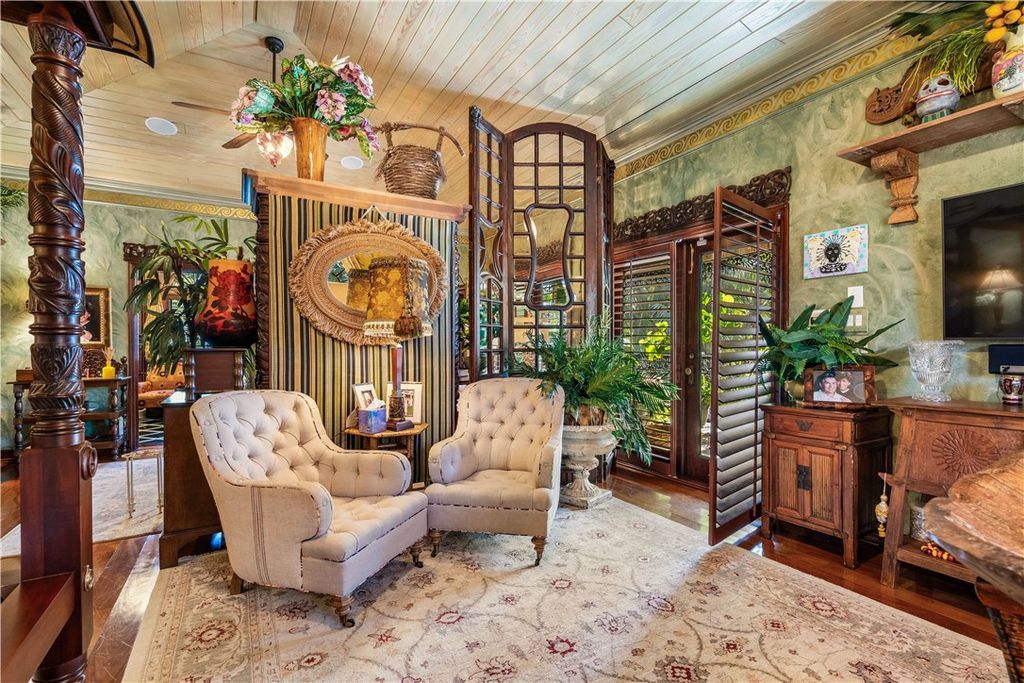 Nestled amid native tropical landscaping, this expansive estate offers a blend of luxury and tranquility. The 1.69-acre estate features a stunning 3,582 square feet main residence with 3 bedrooms and 4 bathrooms, providing ample space for family and guests.