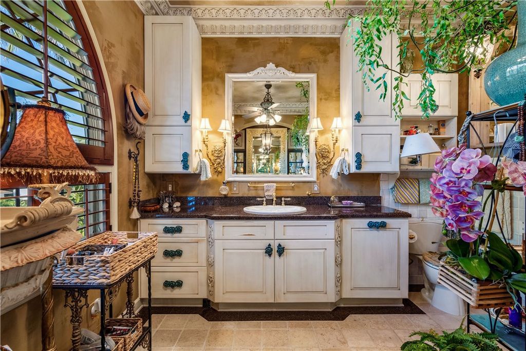 Nestled amid native tropical landscaping, this expansive estate offers a blend of luxury and tranquility. The 1.69-acre estate features a stunning 3,582 square feet main residence with 3 bedrooms and 4 bathrooms, providing ample space for family and guests.