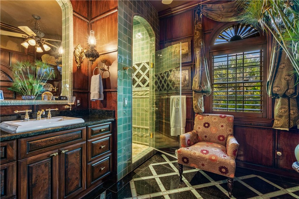 Nestled amid native tropical landscaping, this expansive estate offers a blend of luxury and tranquility. The 1.69-acre estate features a stunning 3,582 square feet main residence with 3 bedrooms and 4 bathrooms, providing ample space for family and guests.