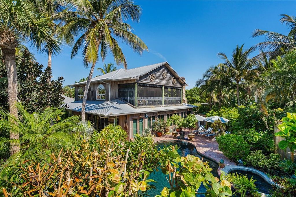 Nestled amid native tropical landscaping, this expansive estate offers a blend of luxury and tranquility. The 1.69-acre estate features a stunning 3,582 square feet main residence with 3 bedrooms and 4 bathrooms, providing ample space for family and guests.