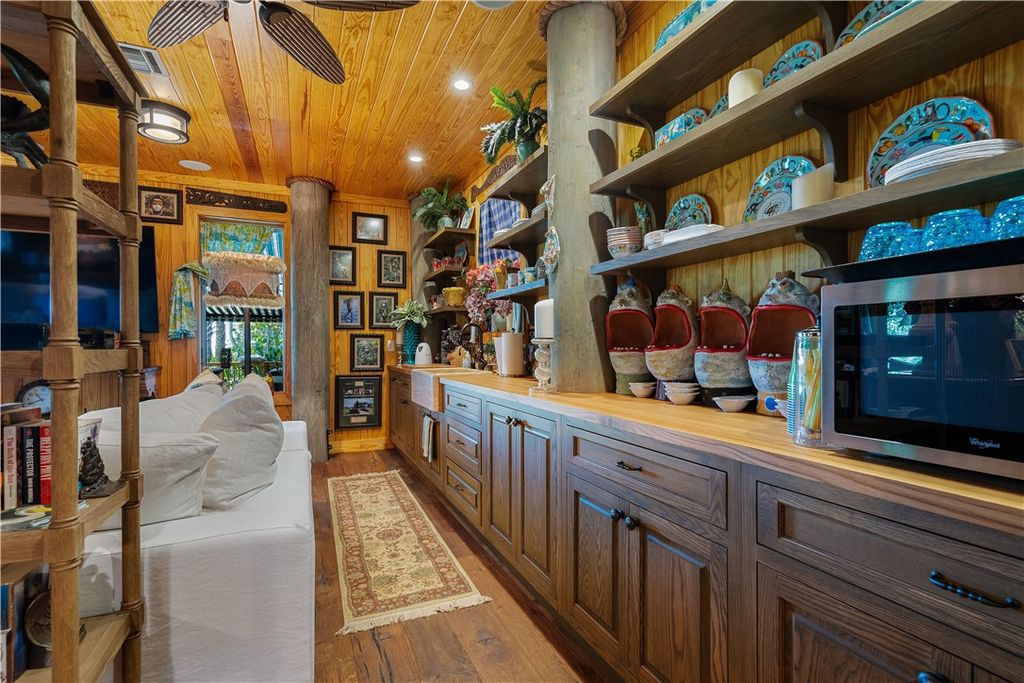 Nestled amid native tropical landscaping, this expansive estate offers a blend of luxury and tranquility. The 1.69-acre estate features a stunning 3,582 square feet main residence with 3 bedrooms and 4 bathrooms, providing ample space for family and guests.
