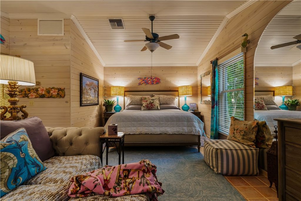 Nestled amid native tropical landscaping, this expansive estate offers a blend of luxury and tranquility. The 1.69-acre estate features a stunning 3,582 square feet main residence with 3 bedrooms and 4 bathrooms, providing ample space for family and guests.