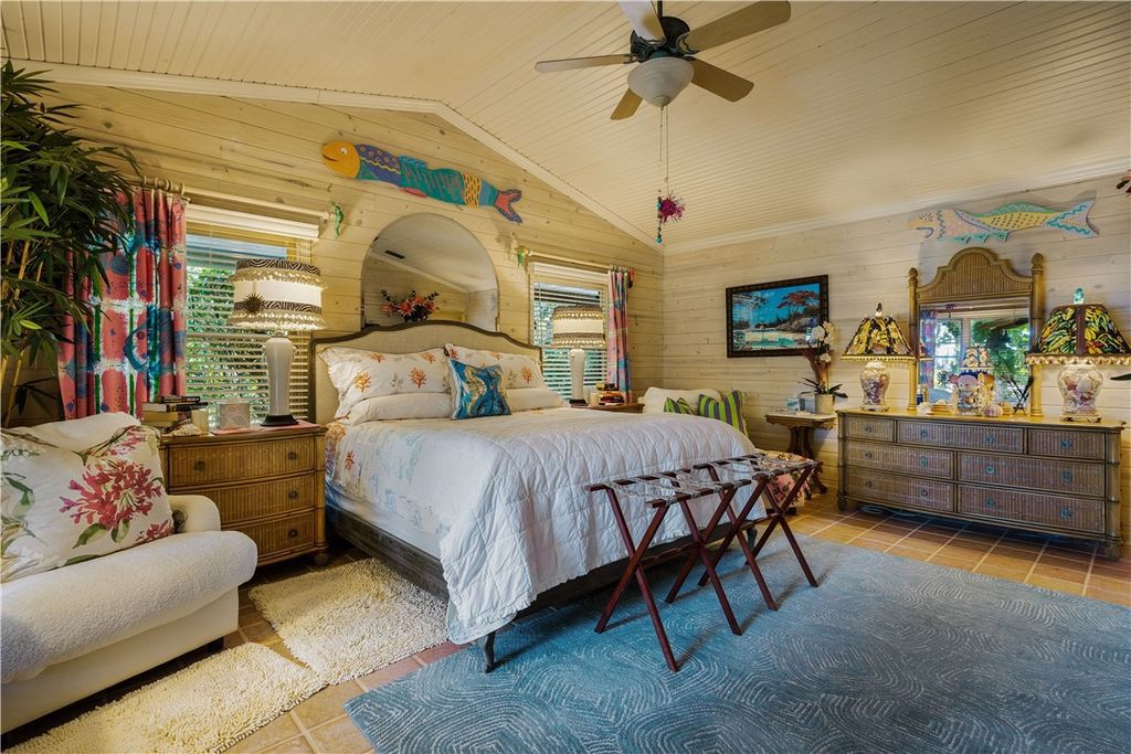 Nestled amid native tropical landscaping, this expansive estate offers a blend of luxury and tranquility. The 1.69-acre estate features a stunning 3,582 square feet main residence with 3 bedrooms and 4 bathrooms, providing ample space for family and guests.