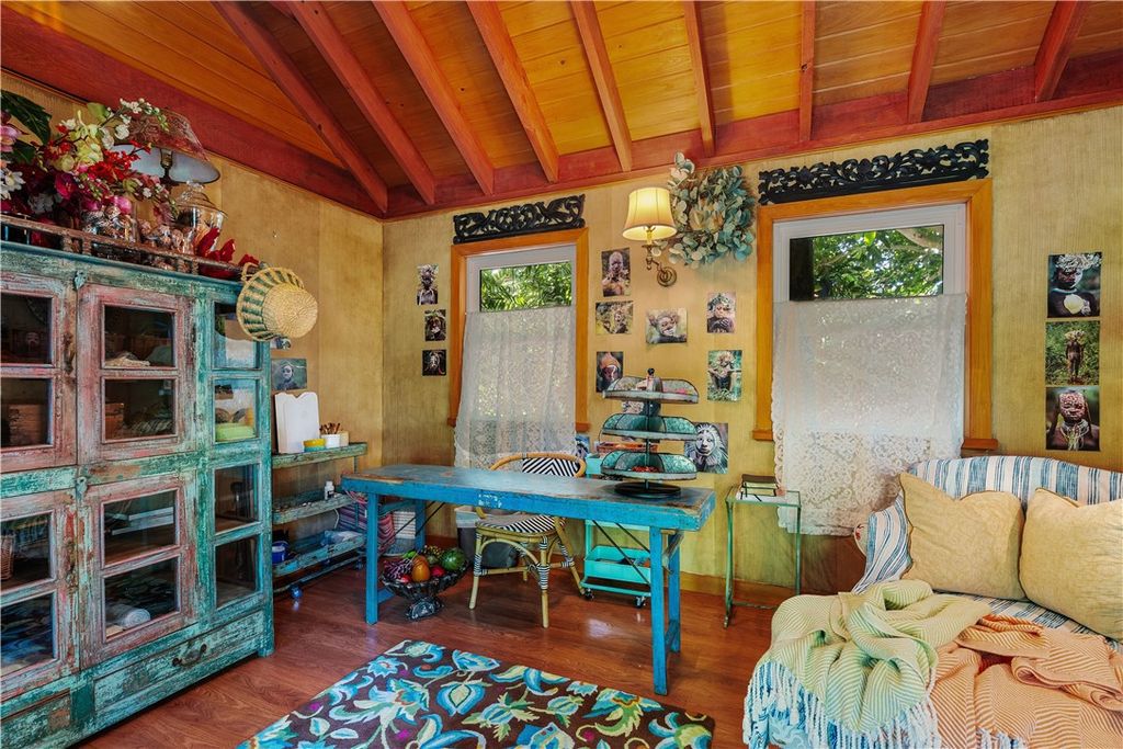 Nestled amid native tropical landscaping, this expansive estate offers a blend of luxury and tranquility. The 1.69-acre estate features a stunning 3,582 square feet main residence with 3 bedrooms and 4 bathrooms, providing ample space for family and guests.
