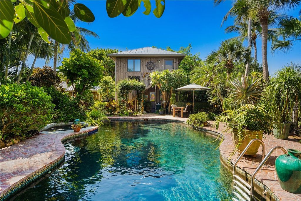 Nestled amid native tropical landscaping, this expansive estate offers a blend of luxury and tranquility. The 1.69-acre estate features a stunning 3,582 square feet main residence with 3 bedrooms and 4 bathrooms, providing ample space for family and guests.