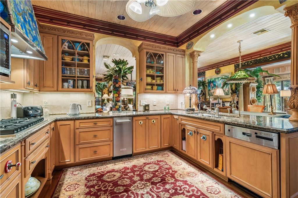 Nestled amid native tropical landscaping, this expansive estate offers a blend of luxury and tranquility. The 1.69-acre estate features a stunning 3,582 square feet main residence with 3 bedrooms and 4 bathrooms, providing ample space for family and guests.