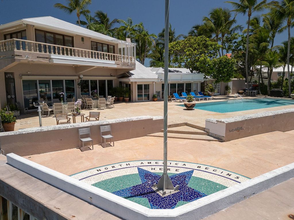 Discover luxury in the Florida Keys with this historic 5-bedroom, 5.5-bathroom home, situated at 400 South St, Key West, FL 33040. Adjacent to the iconic Southernmost Point buoy, this 4,008 square feet residence blends historic charm with modern amenities.